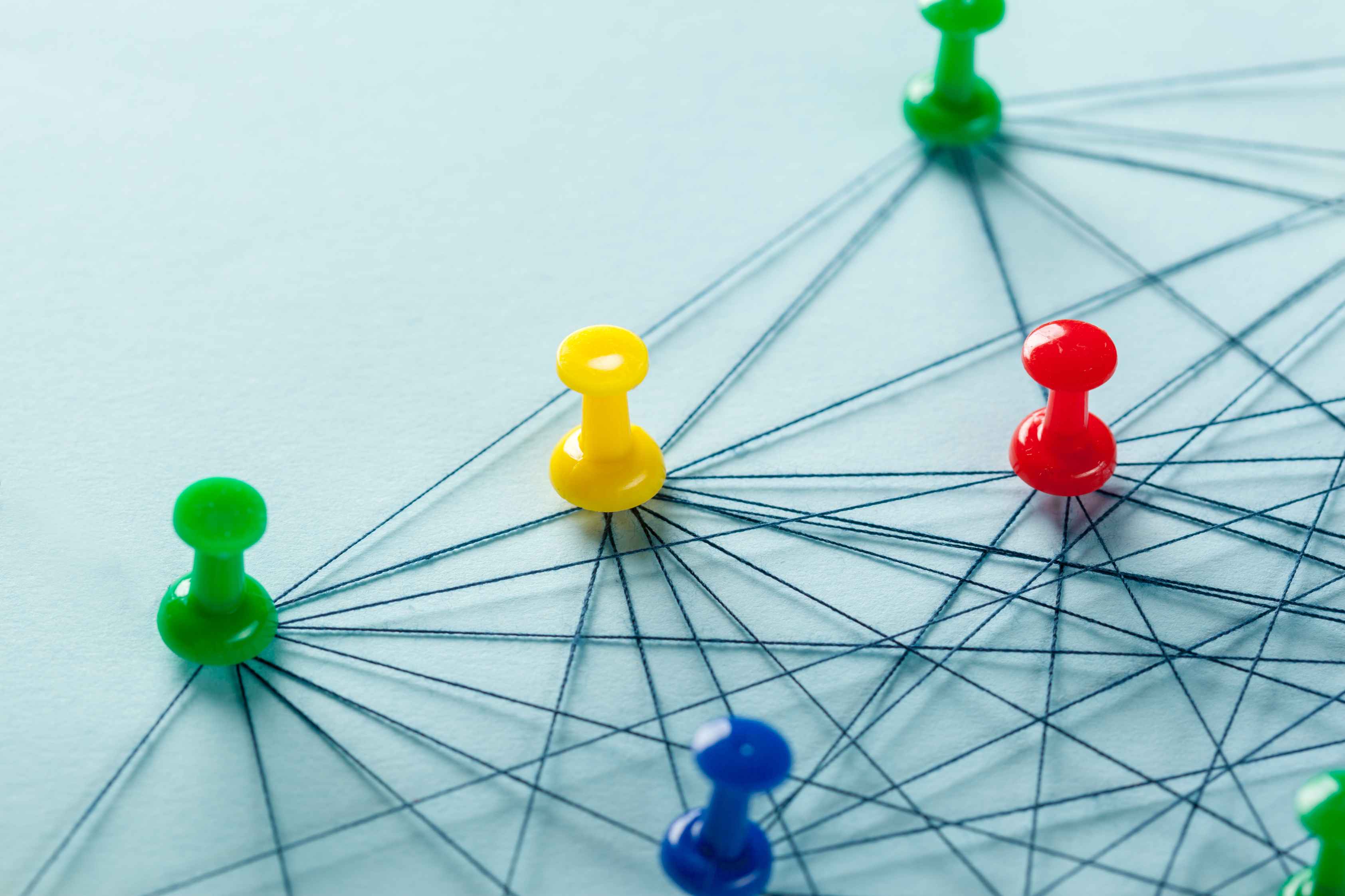 Network of push pins connected by threads